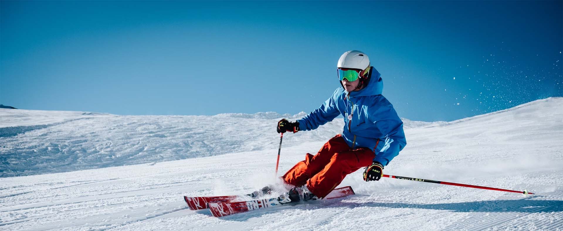 A person skiing down a slope