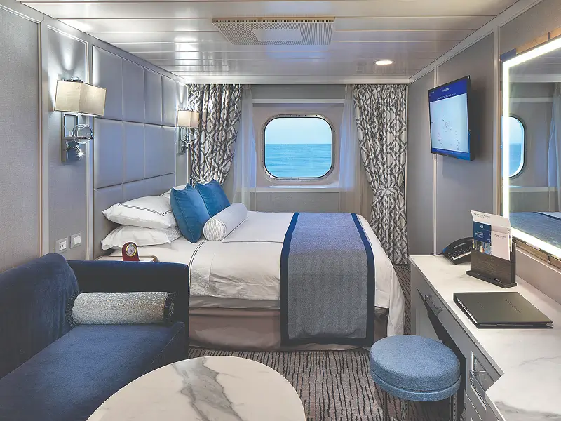 Deluxe ocean-view stateroom with luxury furnishings aboard Oceania Nautica