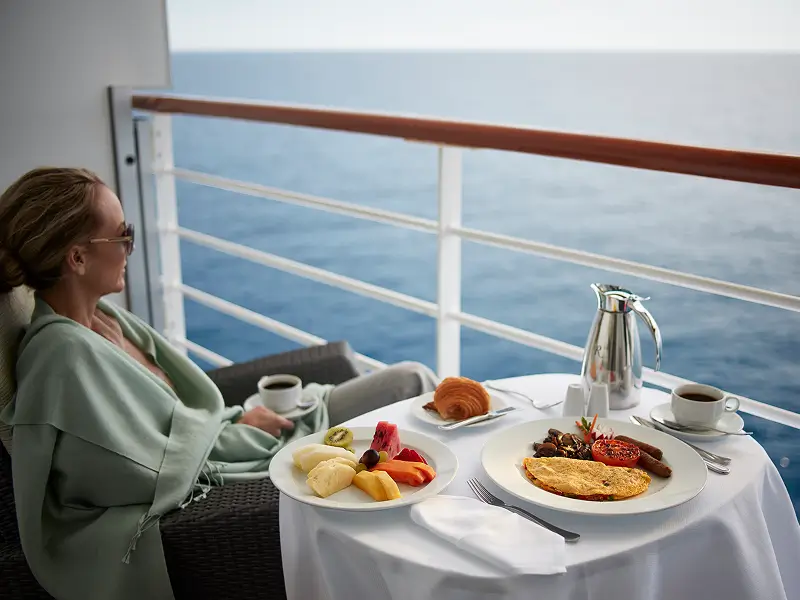 Room service breakfast with ocean views in an Oceania Nautica stateroom