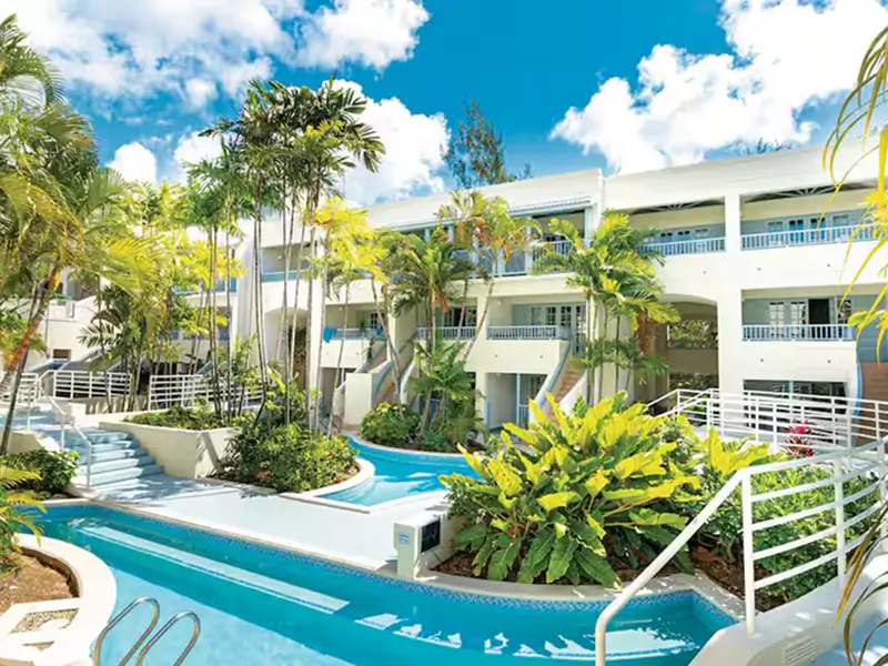 4-star Savannah Beach Club Hotel exterior with Caribbean Sea beachfront and pools in Hastings Barbados